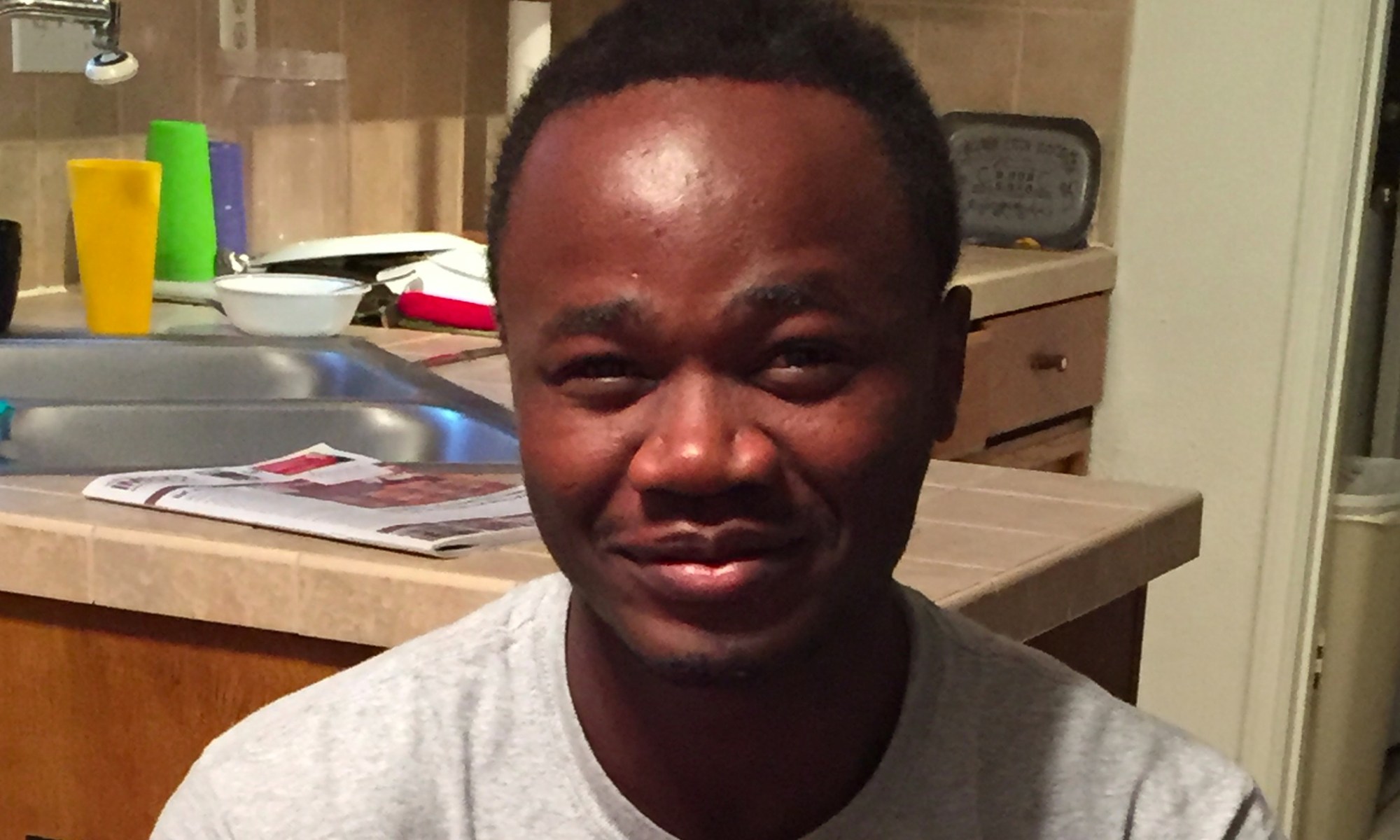 Esperant Kazzembe poses for a photograph.